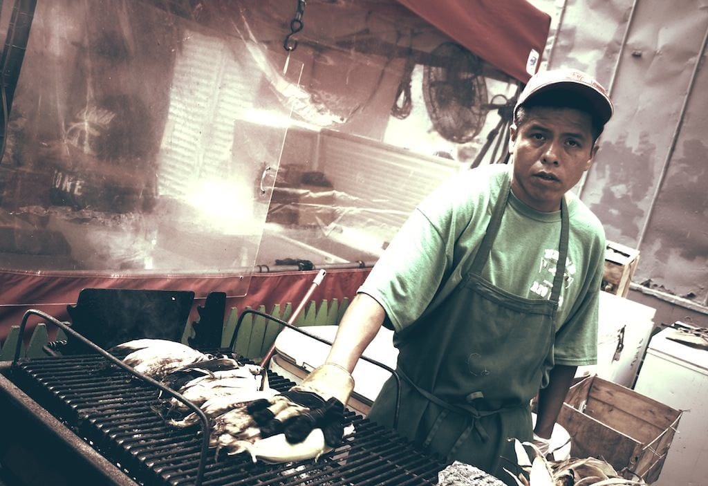 Cook at smoking grill