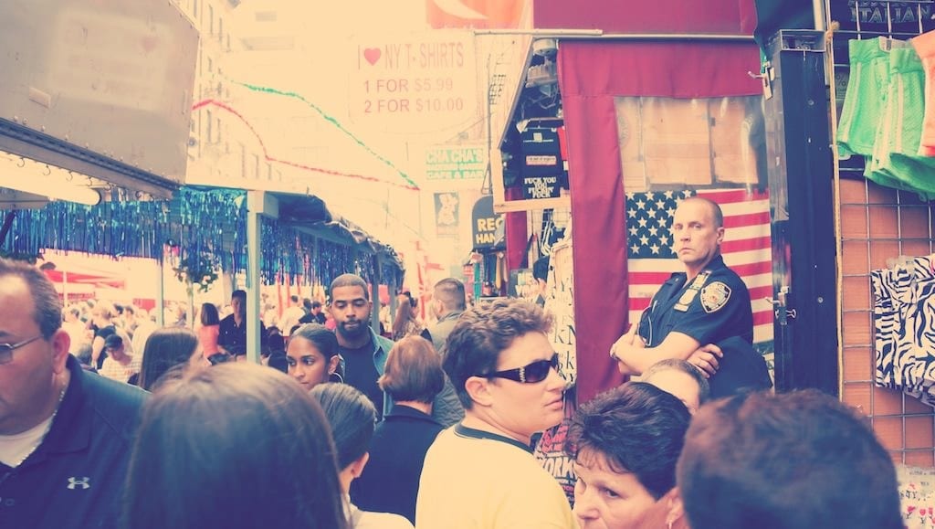 Crowd beneath festival signs