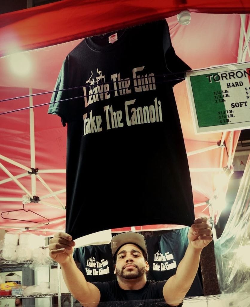 Man holding up t shirt