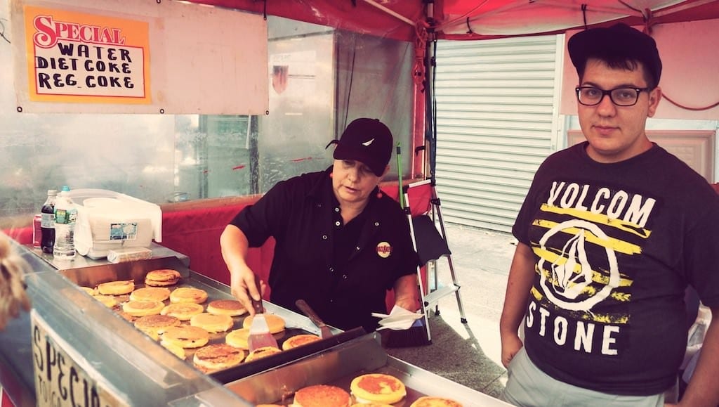 Men at street food grill
