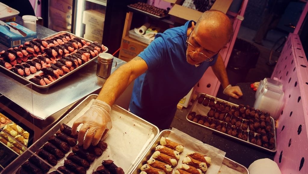 Vendor grilling sausages