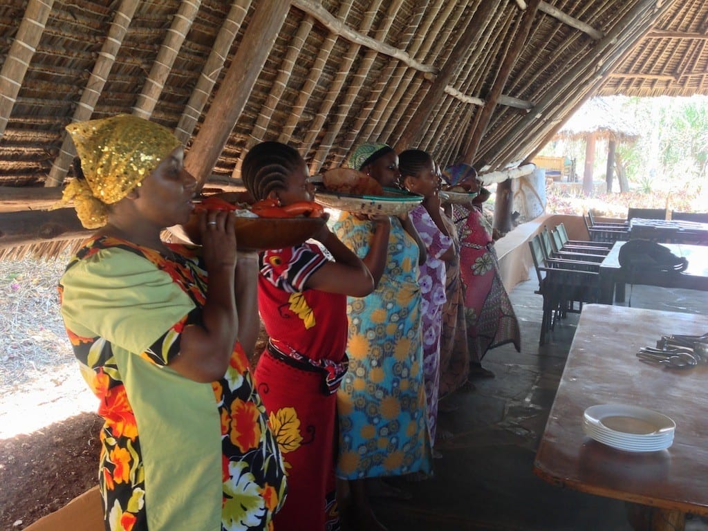 These platter-carrying ladies were singing and describing the dishes.