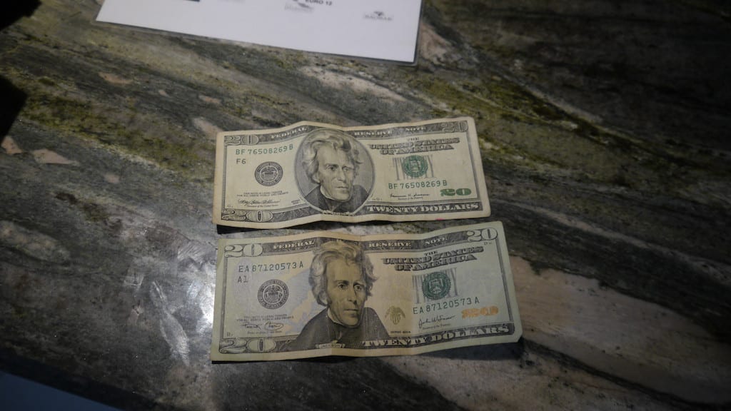 Dollar notes on wooden table