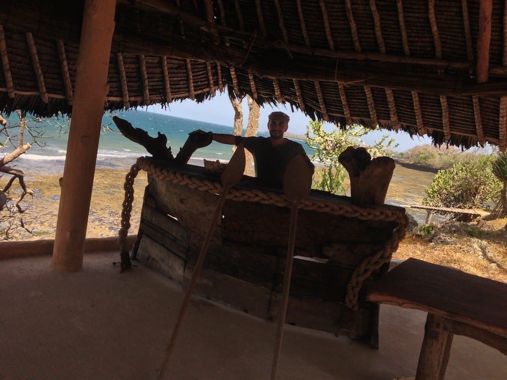 People sitting in open hut