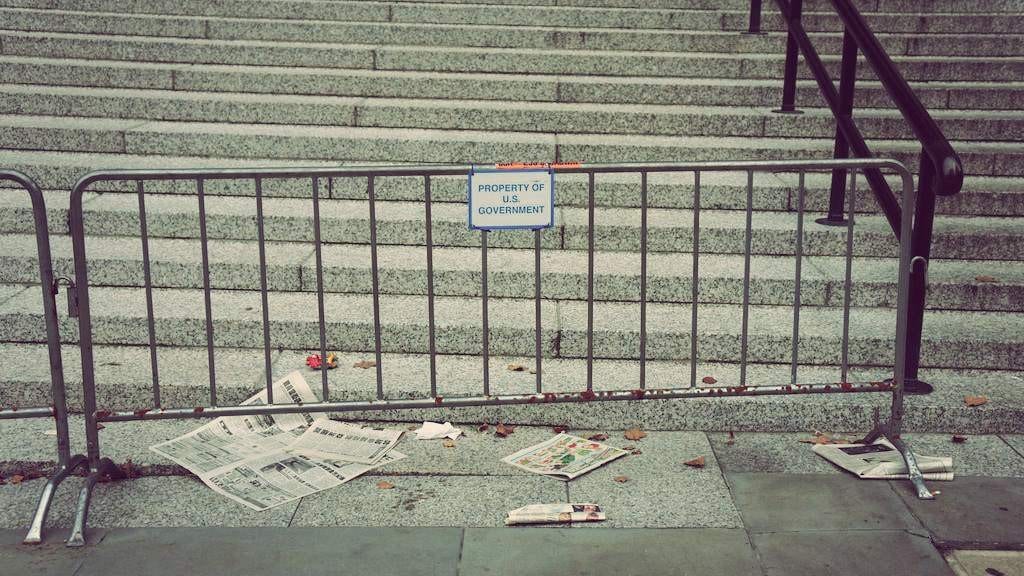 Stairs behind metal barrier
